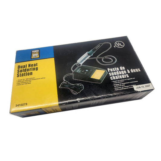 A boxed PCPOS Systems Dual Heat Soldering Station with a switchable 20/40 watt iron and yellow-black design. Front displays the station, coil spring holder, tip cleaner, English/French text, and product number 3410273.