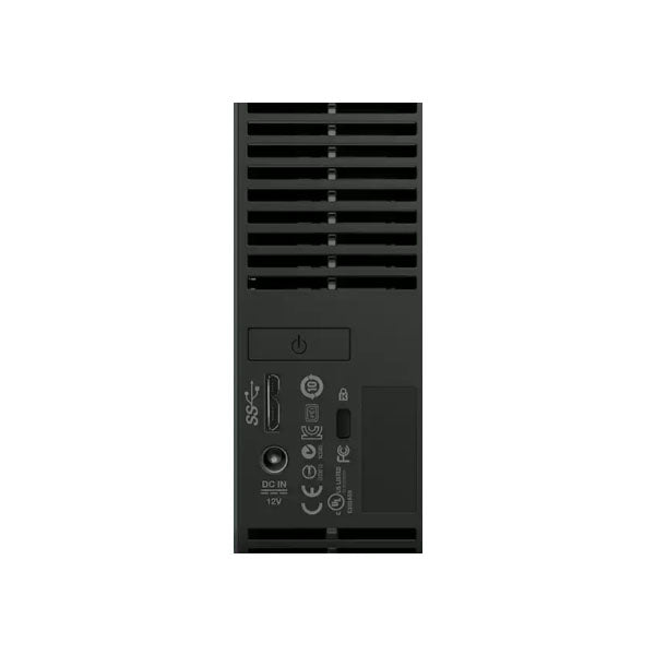 The image shows the back panel of the PCPOS Systems Western Digital My Book Essential 1TB USB 3.0/2.0 Desktop External Hard Drive WDBACW0010HBK-NESN, featuring a USB 3.0 port, DC IN 12V port, power button, ventilation slots, and certifications.