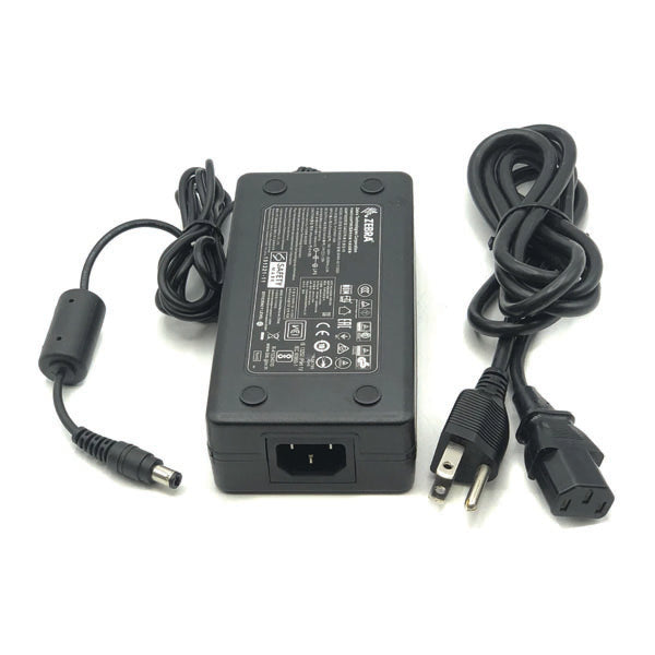 A PCPOS Systems NCR 8770308477 AC adapter for Zebra ZD620 printer (VPN: P1086001-006, Class: 7932-5222) with labeled adapter, DC output cable, and separate three-prong power cord, displayed on a white background.