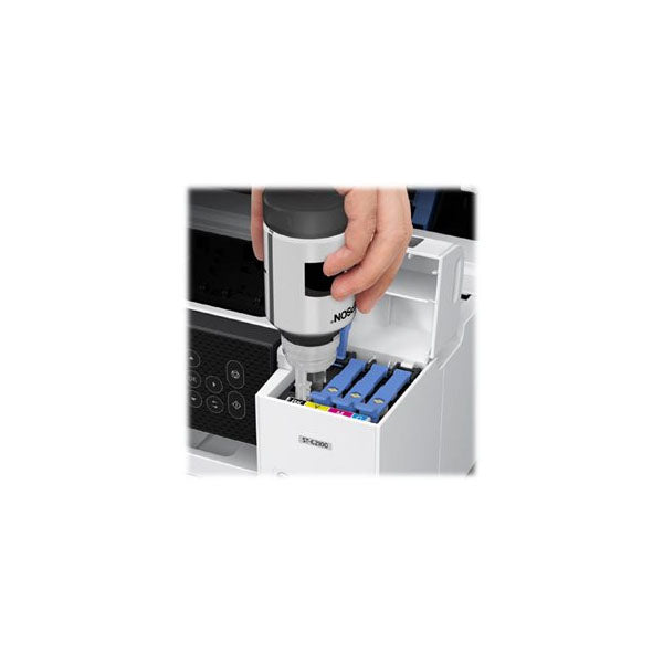 A hand pours black ink into the Epson WorkForce ST-C2100 Supertank Color MFPs tank, ideal for efficient supertank printing. It has individual color compartments for cost-effective ink usage and replacement. Brand: PCPOS Systems.