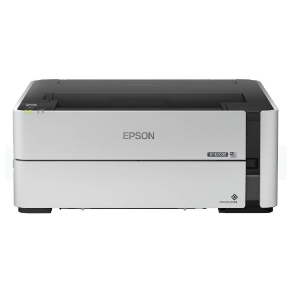 A front view of the monochrome PCPOS Systems Epson WorkForce ST-M1000 printer shows its sleek rectangular design. Featuring PrecisionCore technology, it includes a small display and buttons on the left for effortless, cartridge-free printing with the Epson logo at its center.