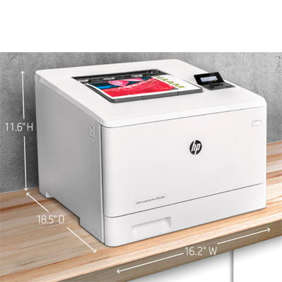 An HP Color LaserJet Pro M454dn by PCPOS Systems is on a wooden desk, measuring 11.6 in height, 18.5 in depth, and 16.2 in width. A printed color page rests on it, while its auto duplex printing and top-tier security features ensure efficiency and safety.