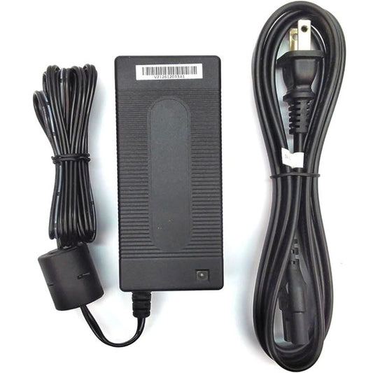 A PCPOS Systems Ingenico PSM32W-080L6 8V 4A debit terminal power supply with black finish, two-prong wall plug, long coiled cord, and 2.1mm DC jack is arranged neatly on a white background.