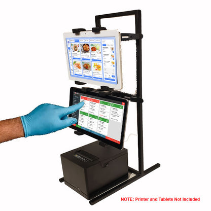 A gloved hand touches a tablet on the black PCPOS Tablet Tower by PCPOS Systems, a POS clamp mount with 3 TabDock holders for 7–10 inch tablets. Ideal for delivery apps and order management. Printer and Tablets Not Included.