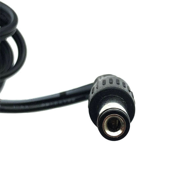 Close-up of a black DC power connector plug on a cable, tip facing camera against white background—compatible with Protran Power Supply (USED Like New, 120VAC 60Hz input, 12V 1.0A 20W output) or similar adapters.