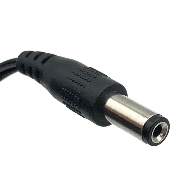 Close-up of a black DC power connector plug with a metal tip, used on 12V power units like the USED Like New Protran Power Supply (Input: 120VAC 60Hz, Output: 12V 1.0A 20W) for powering electronic devices.
