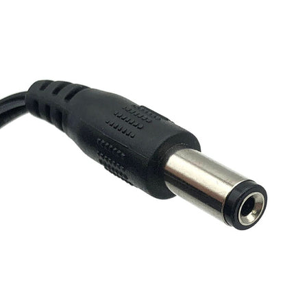 Close-up of a black DC power connector plug with a metal tip, used on 12V power units like the USED Like New Protran Power Supply (Input: 120VAC 60Hz, Output: 12V 1.0A 20W) for powering electronic devices.