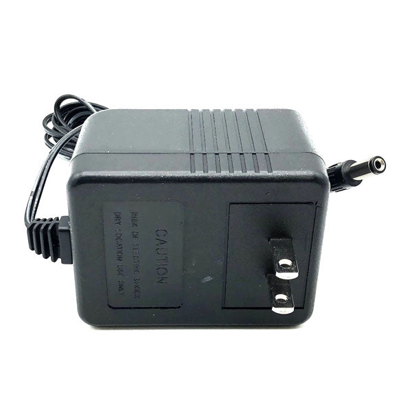 A USED Like New Protran Power Supply (Input: 120VAC 60Hz; Output: 12V 1.0A 20W) with a black two-prong plug and coiled cable ending in a barrel connector, shown against a white background.