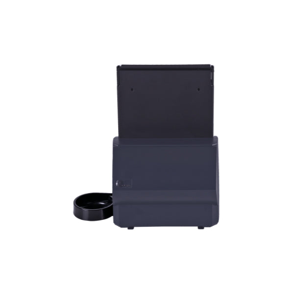 The CPI T-Flex Canadian Coin Dispenser has a sleek black body, digital display, open top lid, and a round side dish—resembling an automatic pet feeder—shown against a white background.