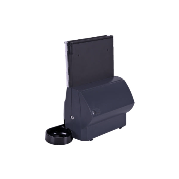 The CPI T-Flex Canadian Coin Dispenser stores coins in a vertical container and dispenses them automatically, similar to how a pet feeder releases food on a set schedule, with an attached tray for easy collection at the bottom.