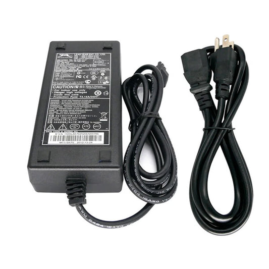 A PCPOS Systems Tiger Power Supply (60W) with a label detailing 120VAC 60Hz input and 24V 3.125A output, plus two black cords: one standard two-prong plug and one connector for the power supply.
