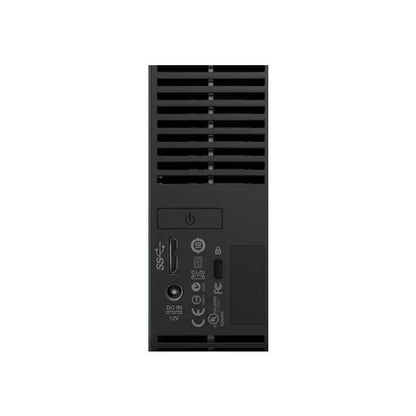 The image shows the back panel of the PCPOS Systems Western Digital My Book Essential 1TB USB 3.0/2.0 Desktop External Hard Drive WDBACW0010HBK-NESN, featuring a USB 3.0 port, DC IN 12V port, power button, ventilation slots, and certifications.