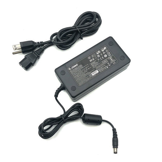 A black PCPOS Systems Zebra AC adapter (NCR Part #: 8770308477, VPN: P1086001-006) for ZD620 printer, with attached cables—one end standard plug, the other cylindrical connector; label lists specs for Zebra printer use.